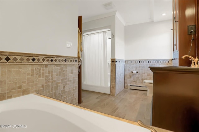full bathroom featuring baseboard heating, toilet, visible vents, wainscoting, and tile walls