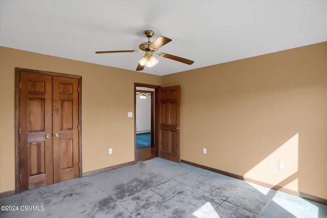 unfurnished bedroom with baseboards, light colored carpet, and a ceiling fan