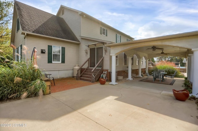 back of house featuring a patio area, roof with shingles, entry steps, and a ceiling fan