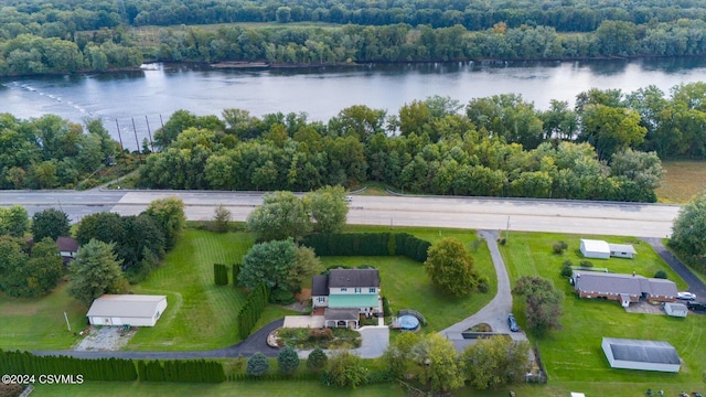 birds eye view of property with a water view and a forest view