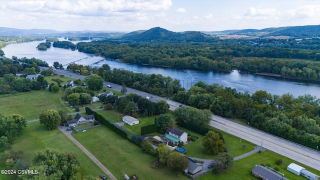bird's eye view with a forest view and a water view