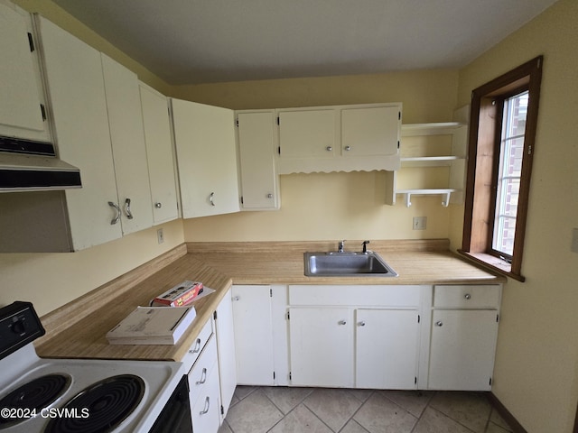 kitchen featuring open shelves, range with electric stovetop, light countertops, under cabinet range hood, and a sink