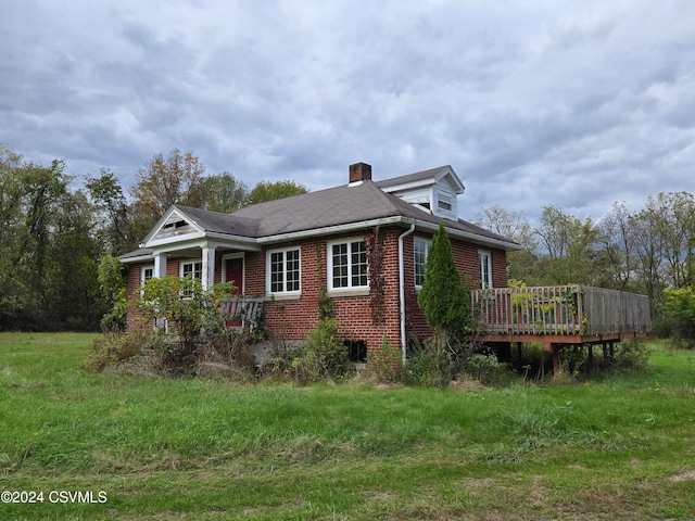 view of side of home with a wooden deck