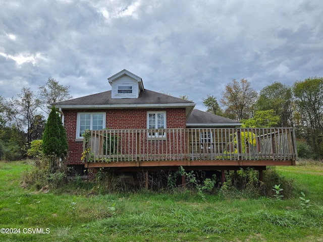 rear view of house with a wooden deck