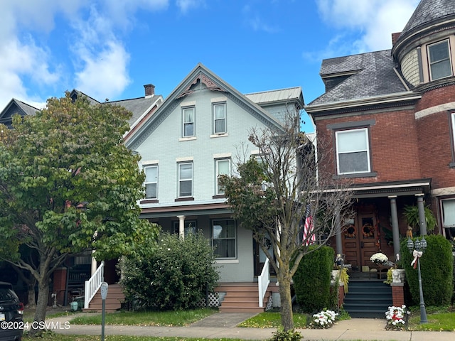 victorian home featuring covered porch