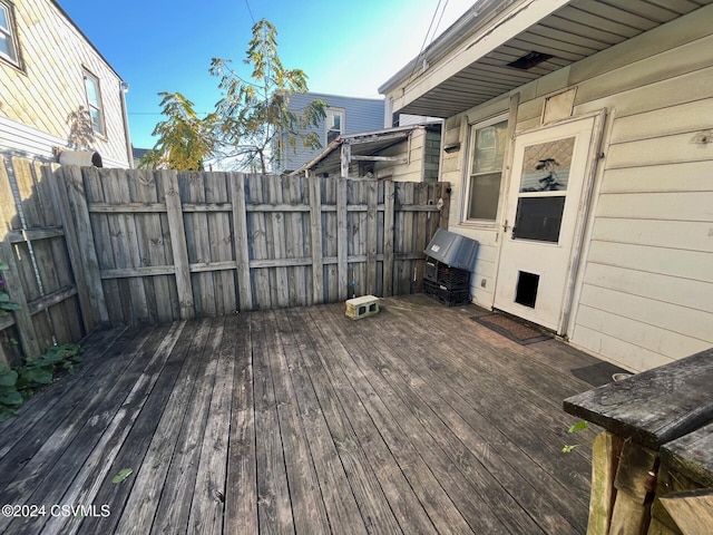 wooden terrace featuring area for grilling