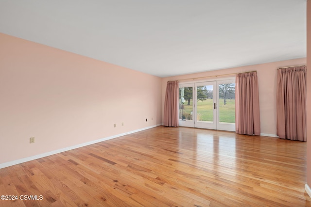 unfurnished room featuring light hardwood / wood-style floors