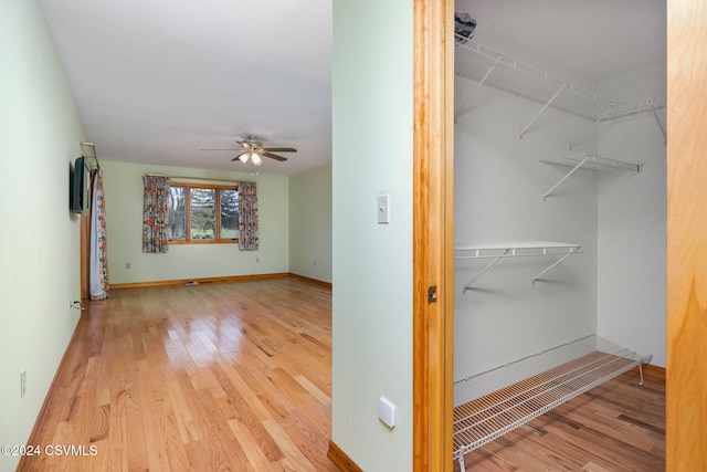 interior space featuring hardwood / wood-style floors and ceiling fan