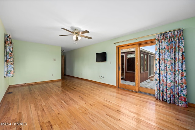 spare room with ceiling fan and light hardwood / wood-style flooring