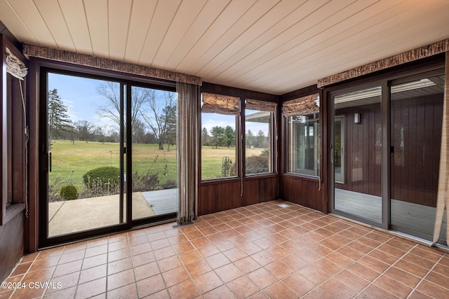 unfurnished sunroom with plenty of natural light