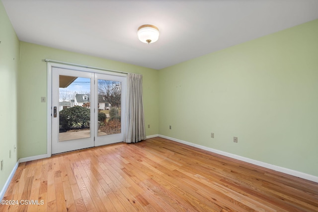 spare room with light hardwood / wood-style floors