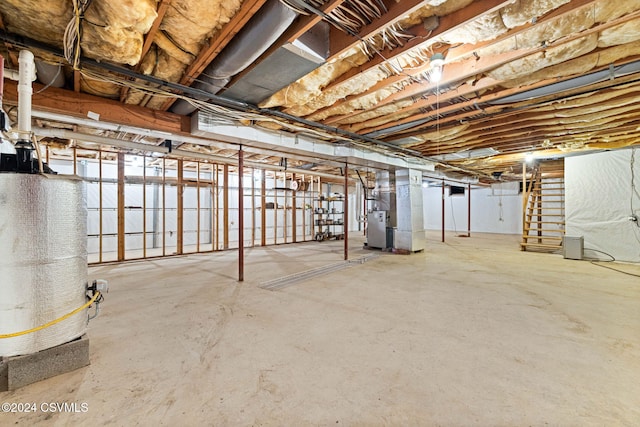 basement featuring gas water heater and heating unit