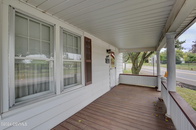 wooden terrace featuring covered porch