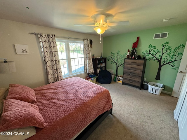 bedroom with ceiling fan and carpet flooring