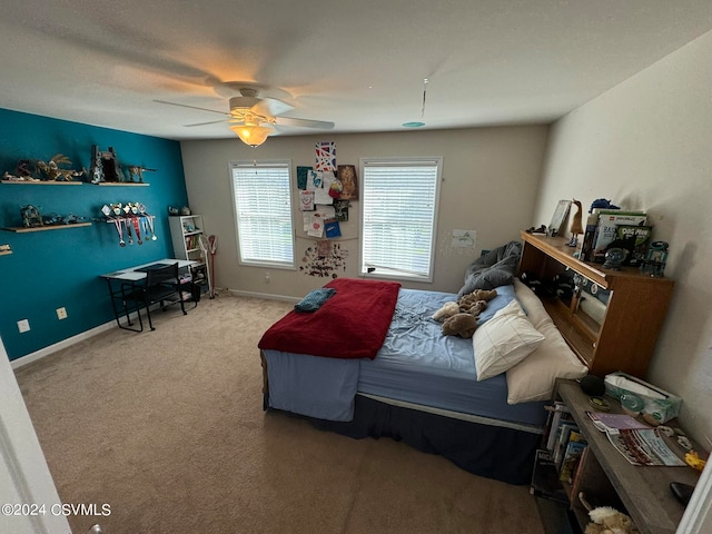 bedroom with ceiling fan and carpet flooring