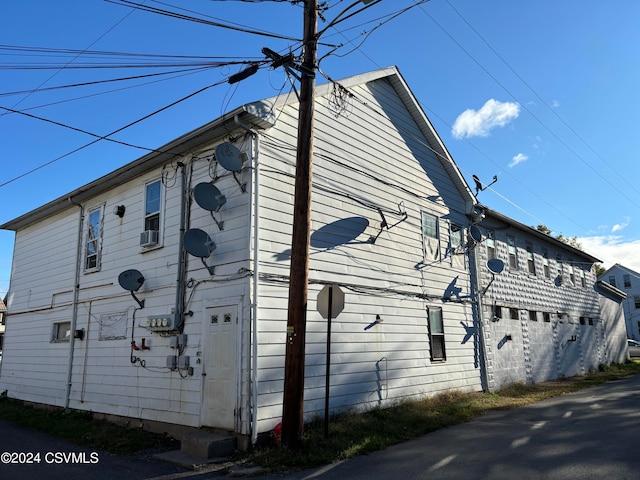 view of home's exterior with cooling unit