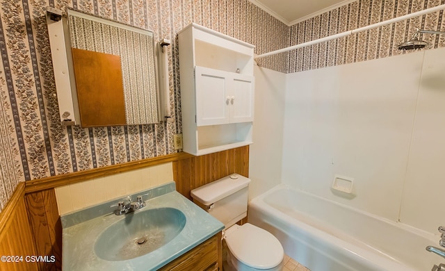 full bathroom with toilet, shower / bathing tub combination, ornamental molding, and vanity