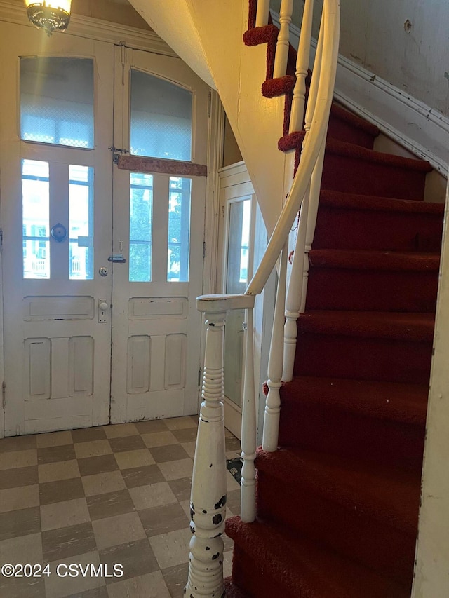 foyer entrance featuring french doors