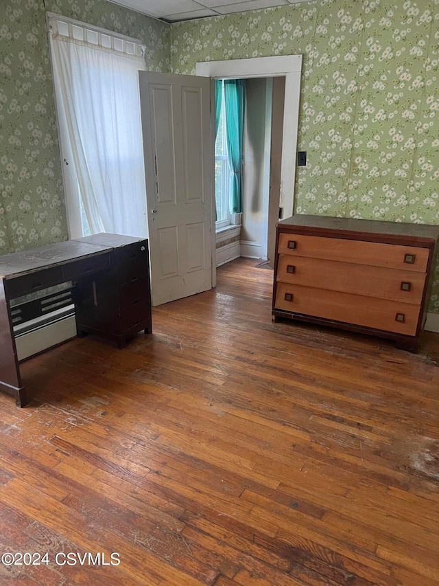 unfurnished bedroom featuring dark wood-type flooring