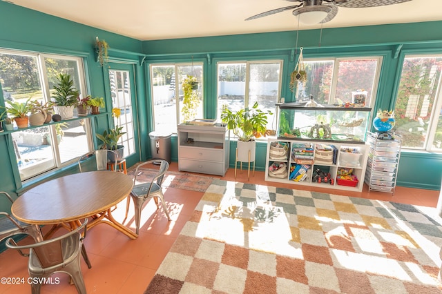 sunroom / solarium with ceiling fan and plenty of natural light