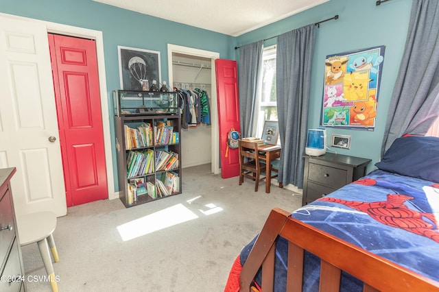 carpeted bedroom with a closet