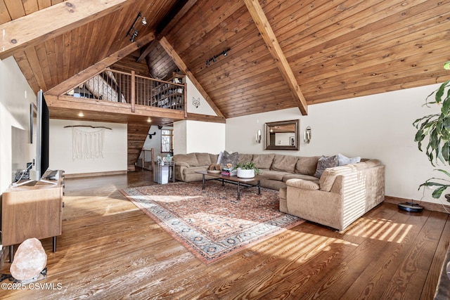 living area with stairs, hardwood / wood-style floors, beamed ceiling, and wood ceiling