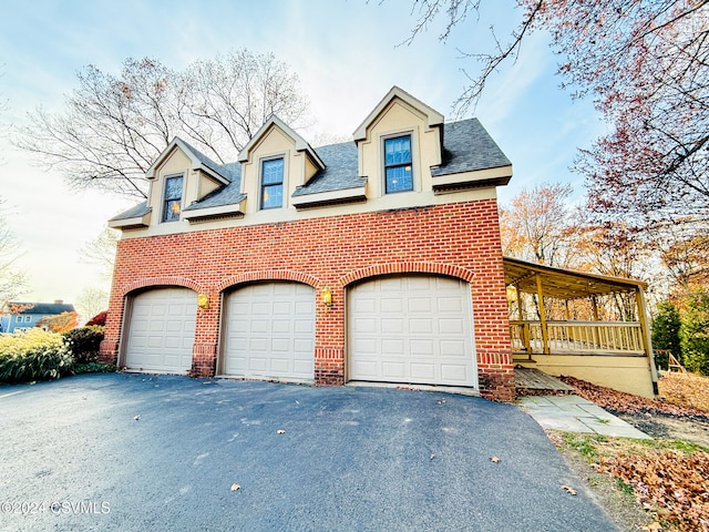 view of front of house with a garage and covered porch