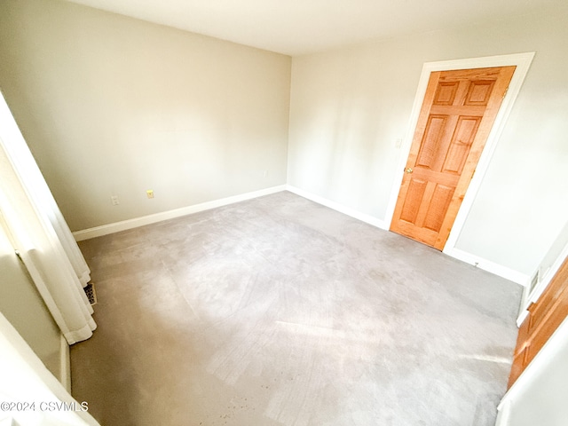 empty room with light colored carpet