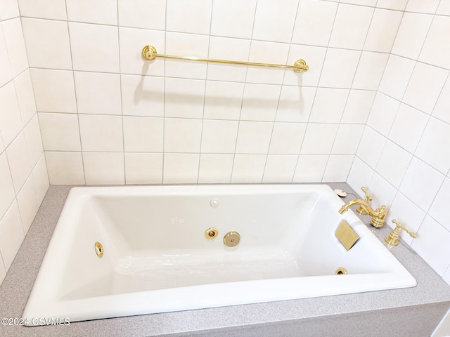 bathroom with a tub to relax in