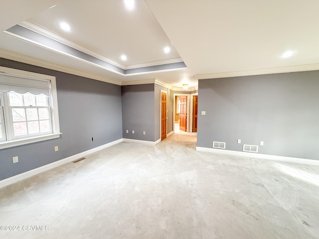 basement featuring light carpet and ornamental molding