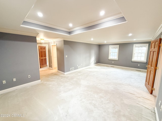 basement with light carpet and crown molding