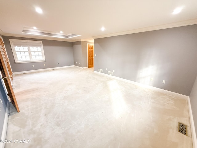 basement featuring light colored carpet and ornamental molding