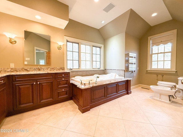 bathroom featuring a bidet, lofted ceiling, toilet, a bathing tub, and vanity