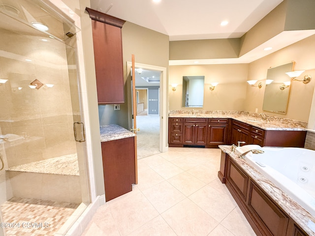 bathroom featuring tile patterned flooring, vanity, and separate shower and tub