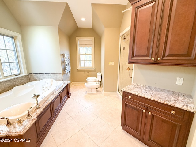 bathroom with a bidet, tile patterned flooring, shower with separate bathtub, lofted ceiling, and toilet