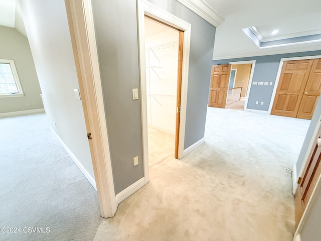 hallway featuring light carpet and ornamental molding