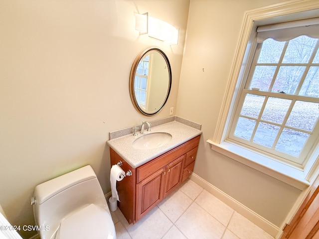 bathroom with tile patterned floors, vanity, and toilet