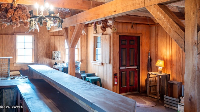 bar with beam ceiling and wooden walls