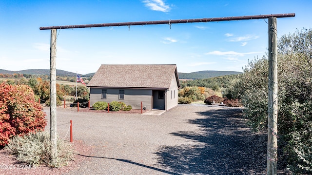 view of side of home featuring a mountain view