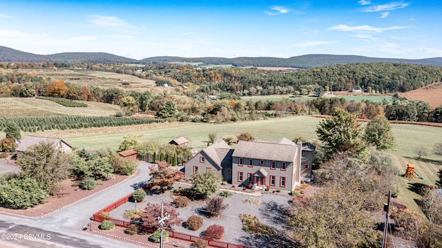 drone / aerial view featuring a mountain view and a rural view