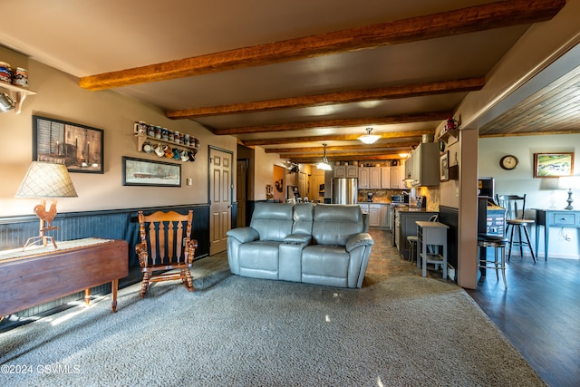 living room featuring beamed ceiling