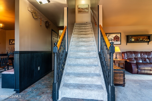 stairs featuring carpet