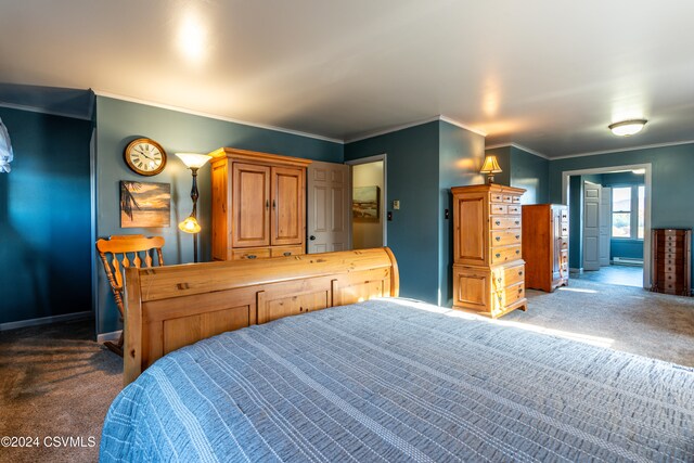 bedroom with crown molding, a baseboard radiator, and carpet floors