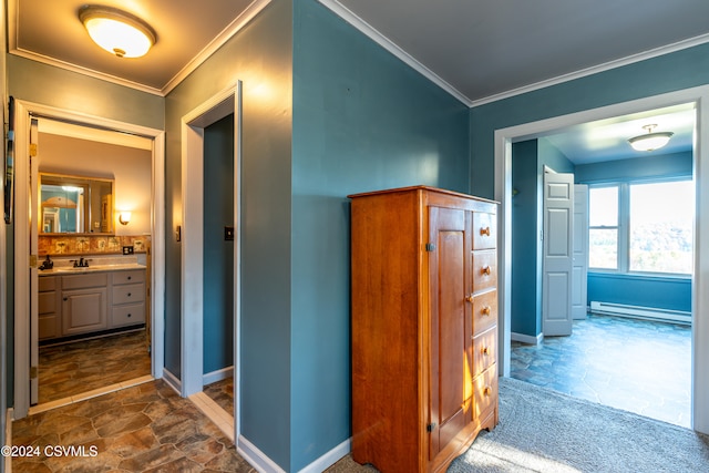 hall featuring sink, crown molding, and baseboard heating