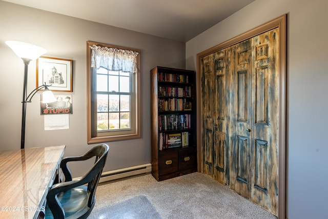 office featuring light carpet and a baseboard heating unit