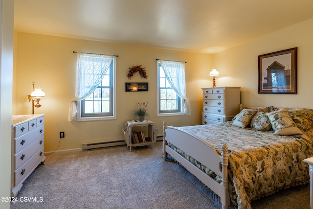 bedroom featuring carpet and a baseboard heating unit