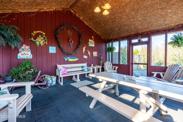 sunroom with lofted ceiling