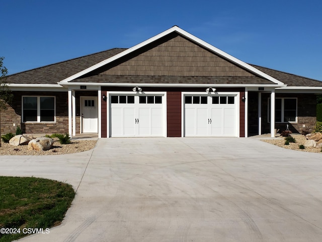 craftsman house with a garage