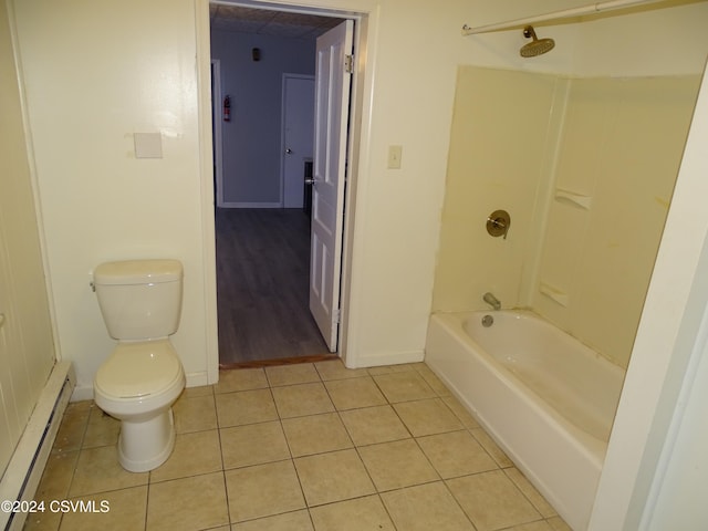 bathroom featuring toilet, wood-type flooring, a baseboard heating unit, and tub / shower combination