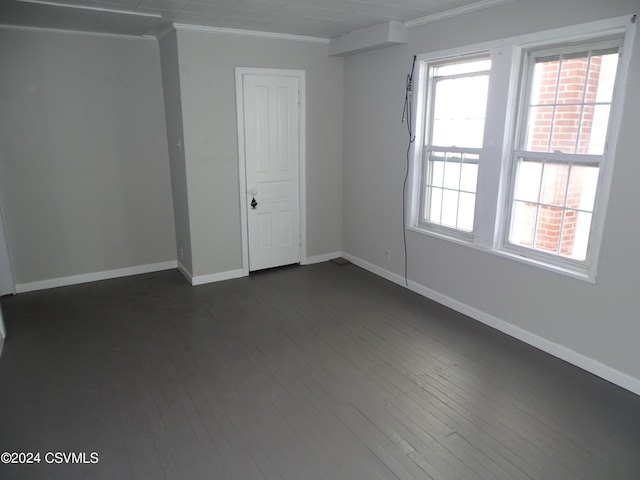 310 W 3rd St, Mount Carmel, PA 17851 - spare room featuring crown molding, baseboards, and dark wood-type flooring
